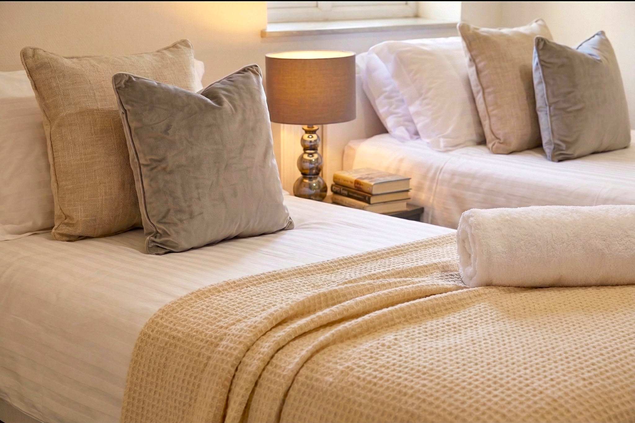 Twin bedroom interior with neutral styling